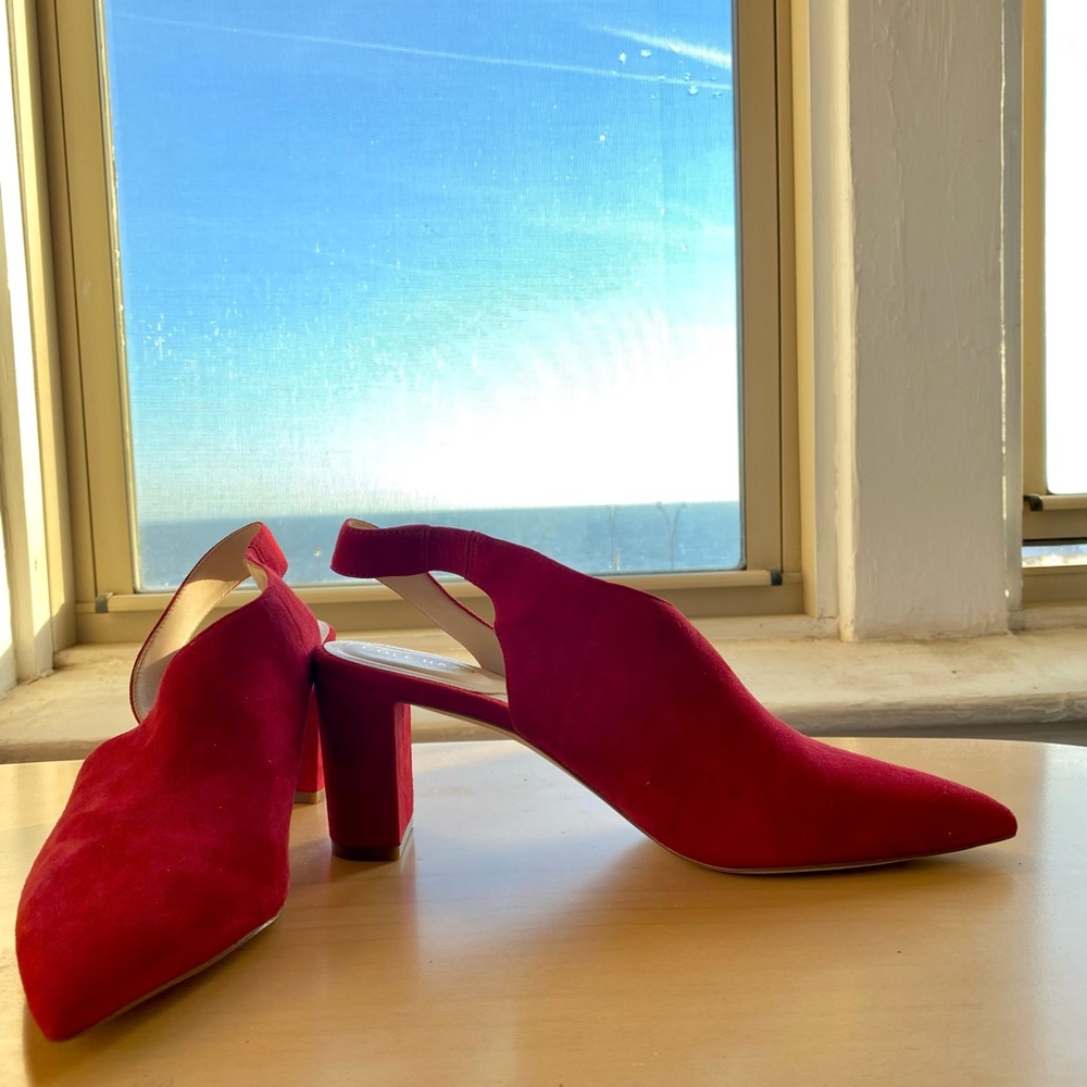 Brand new red asymmetrical soft suede shoes.  Thick heels about 3”